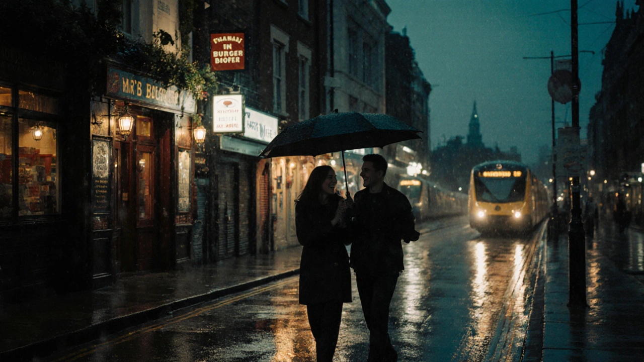 A couple walks under an umbrella on a rainy street near a pub, train station in the distance.