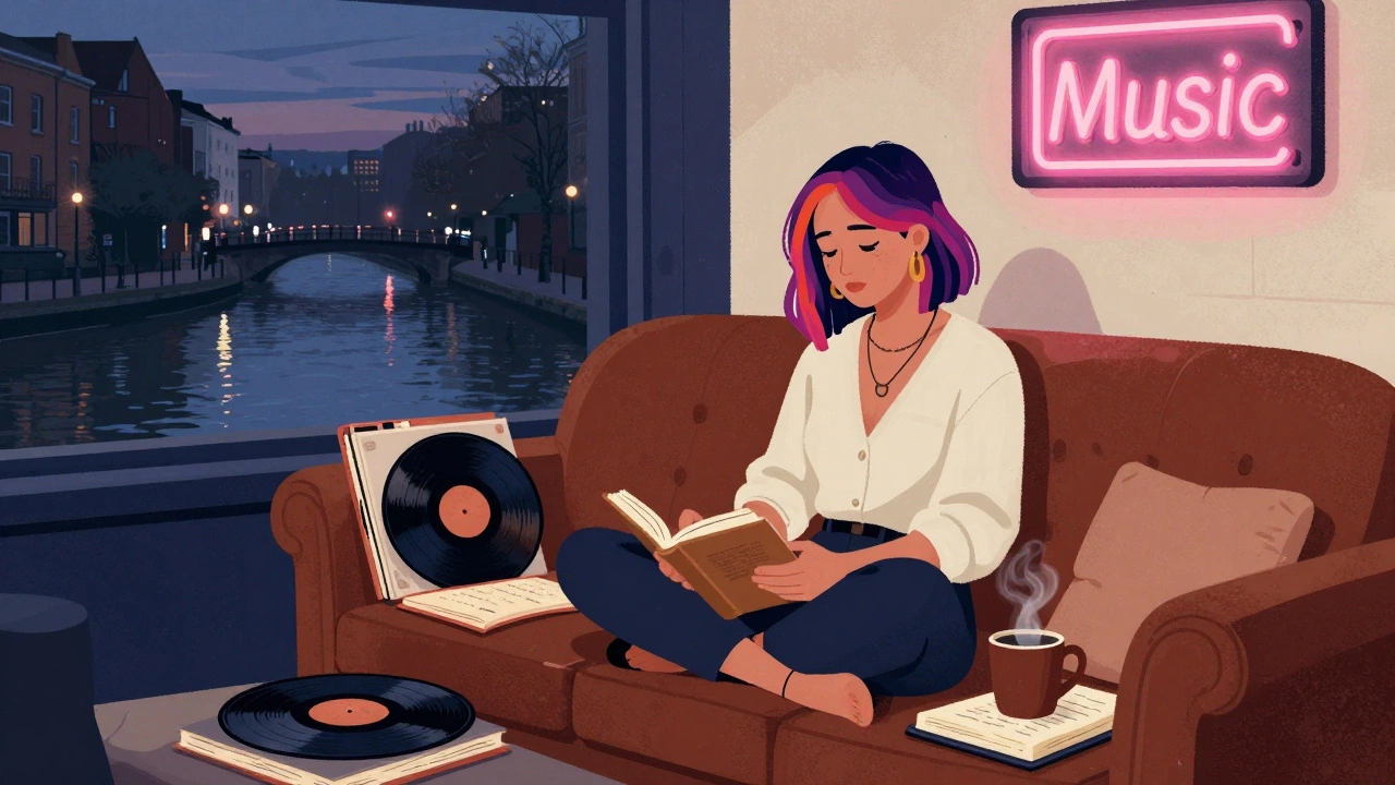 A creative woman in Camden sits among books and vinyl records, twilight glowing through the window as the canal reflects the city's quiet energy.