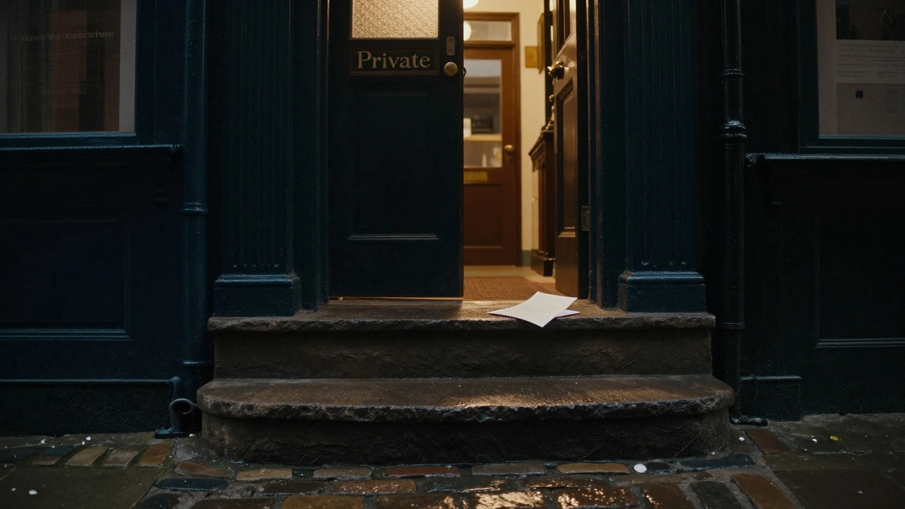 A dimly lit stairway leads up from a vintage shop, a folded note left on the step, soft lamplight from above.