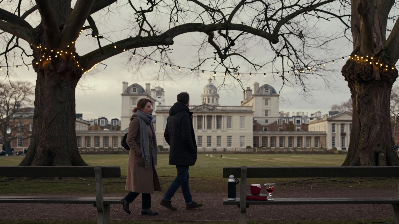 A couple strolls through the Royal Park under Christmas lights, a thermos and book on the bench nearby.