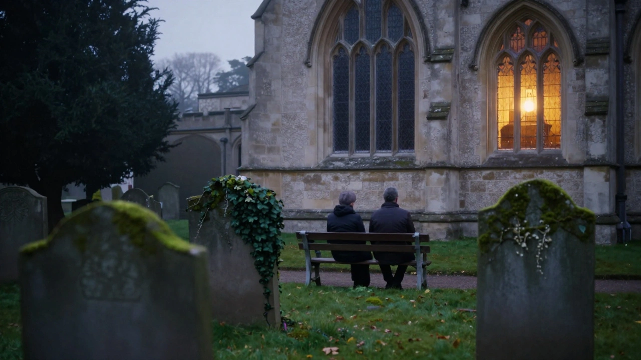 Quiet figures seated at dusk in St. Mary’s Churchyard, lantern light glowing.