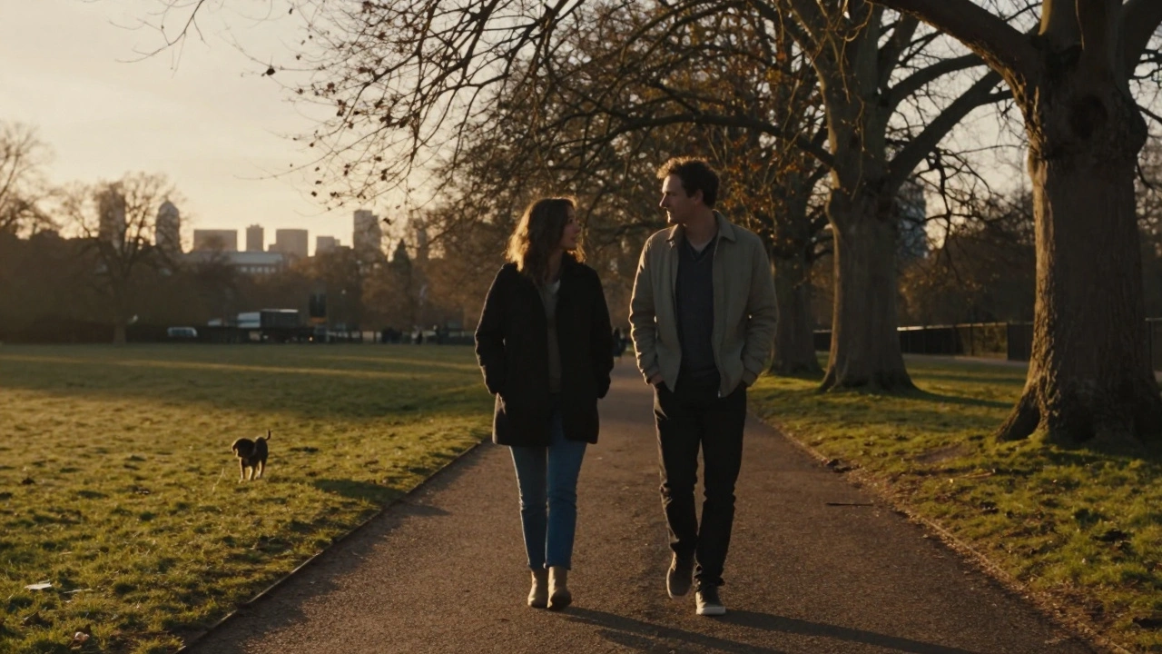Two people walk peacefully through Crystal Palace Park at sunset, dog ahead, no physical contact.