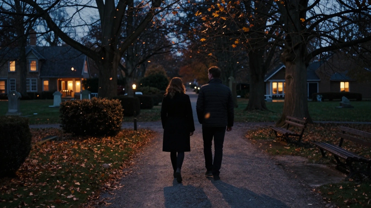 Two figures walking peacefully along a tree-lined park path at twilight in Headstone Manor Park.