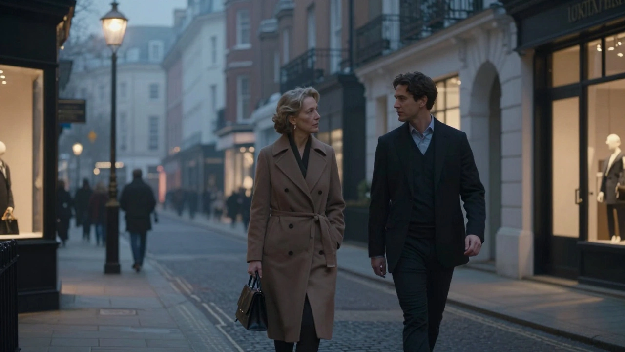 A sophisticated couple walking peacefully through a misty London street at dusk, engaged in quiet conversation.